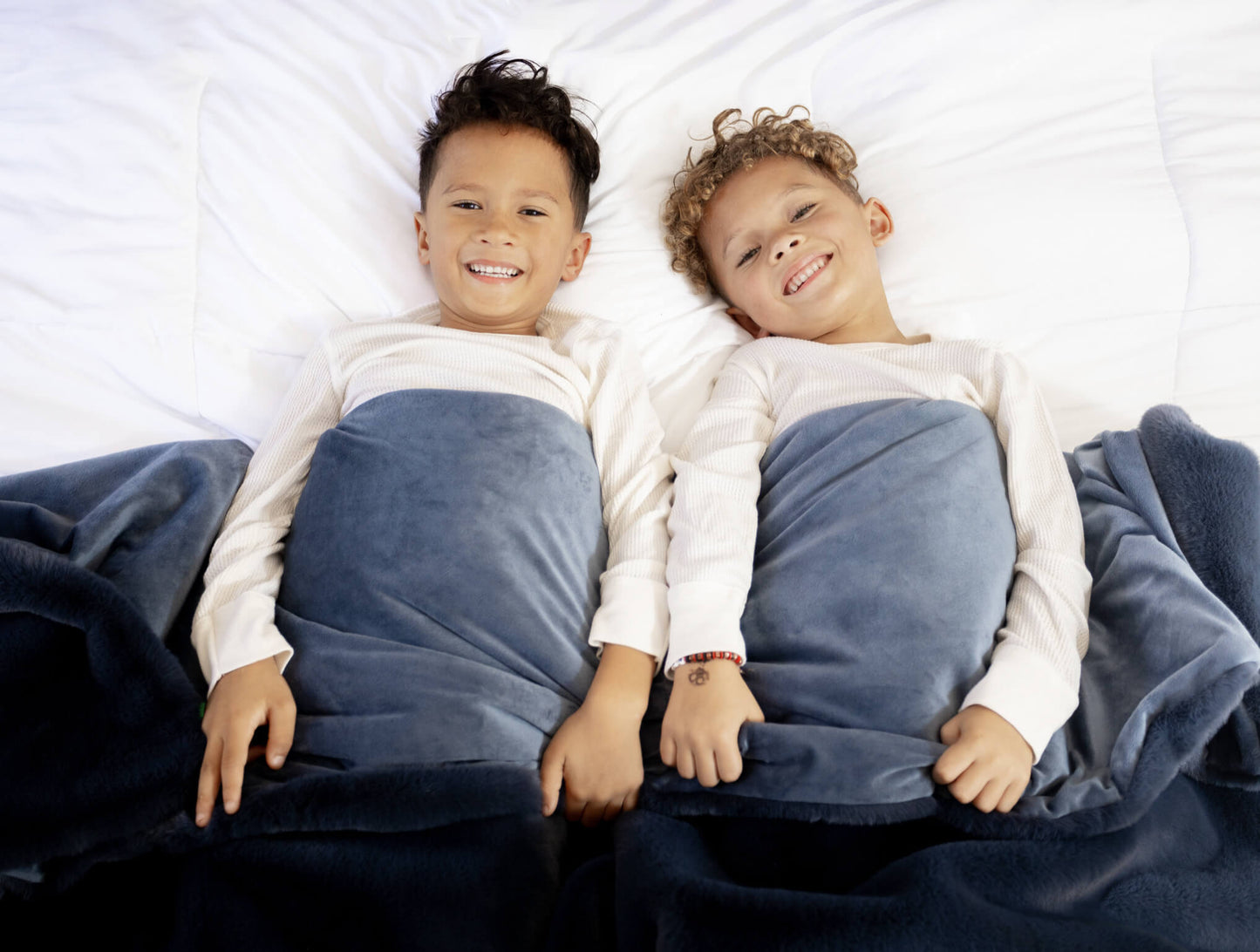 Kids with cozy throw blanket